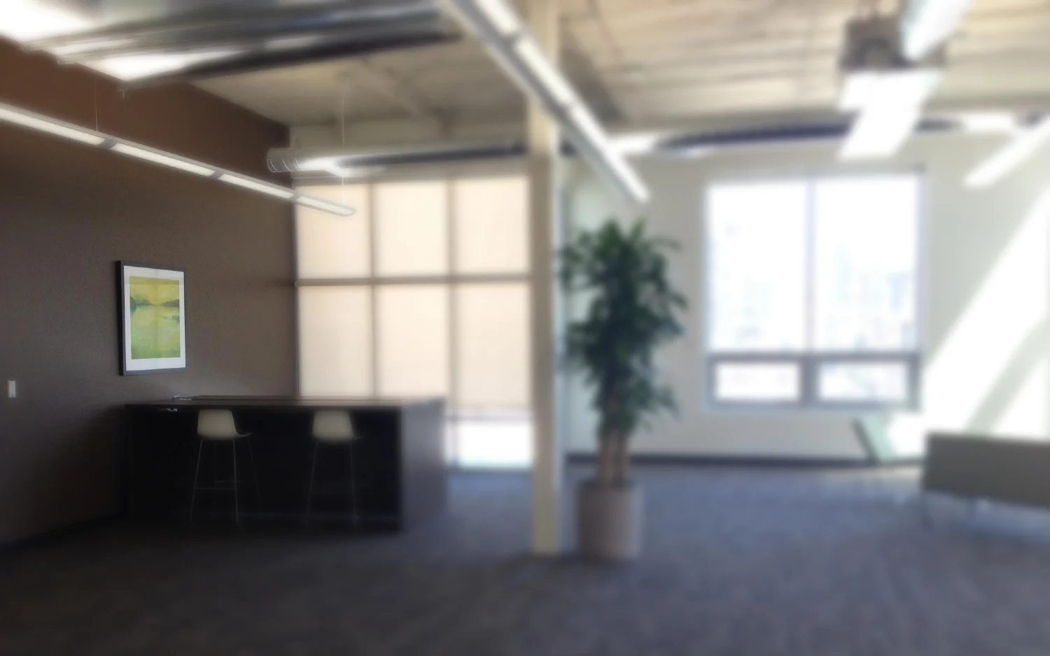 Framed artwork in a bright open-plan office